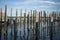 Rows of Dock Piles in Blue Water against Blue Cloudy Sky