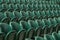 Rows of empty green spectators` chairs at Wimbledon All England Lawn Tennis Club.