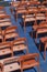 Rows of empty orange chairs on the deck of a river boat