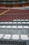 Rows of empty orange and white seats in the sports complex of the Estadio Nacional - Soccer Stadium - in Lima Peru