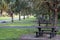 Rows of empty picnic tables in a campground in Florida