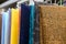 Rows of fabrics hanging at a market stall