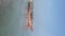 Rows of fishing boats leaning on a sandy beach