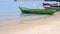 Rows of fishing boats moored on the beach during the day