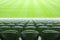 Rows of folded plastic seats in empty stadium