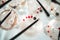 Rows of glasses with light pink beverage on buffet table top view. Close up of drink with fresh berries and straw