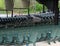 Rows of green metal chairs for audience at outdoor music venue