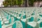 Rows of green plastic chairs outdoor celebration event