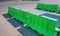 Rows of Green Plastic Road Barriers