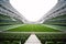 Rows of green seats in an empty stadium