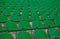 rows of green tribunes in a huge stadium