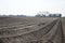 Rows of ground on field for growth of asparagus vegetable on Goeree Overflakkee in the Netherlands.