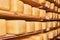 Rows of heads of cheese in maturing storehouse