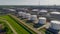 Rows of huge white gas tanks at refinery plant aerial view