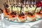 Rows of italian cakes on a glass stand