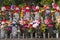 Rows jizo statues with red bibs, hats, flower and colorful wind mills at Zojoji temple in Tokyo, Japan. it represent the children