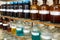 Rows of liquid chemicals in bottles at chemistry