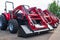 Rows of Mahindra tractors on the street