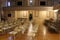 Rows of metal seats arranged to face podium in meeting room, Oneida Community Mansion House, New York, 2018