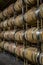 Rows of oak barrels stained with red wine stacked 4 high