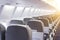 Rows of passenger seats in the cabin airplane.