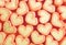 Rows of Pastel Orange and Yellow Heart Shaped Marshmallow Candies for Background