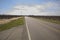 Rows of Peach trees long empty country road