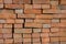 Rows of red bricks laid without mortar