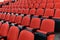 Rows of red chairs in a theatre auditorium