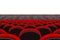 Rows of Red Cinema or Theater Seats in front of Cinema or Theater Scene with Blank Space for Yours Design. 3d Rendering