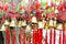 Rows of red wind bells golden buddhist prosperity bell at chinese temple people wish and hang them