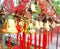 Rows of red wind bells golden buddhist prosperity bell at chinese temple people wish and hang them