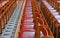 Rows of red wooden chairs in church