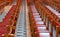 Rows of red wooden church pews