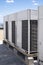 Rows of rooftop HVACs on the roofdeck of an office tower. VRF air conditioner for commercial buildings