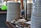 Rows and rows of stacked plates and silverware are lined up in a cruise ship