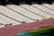 Rows of seats in stadium and track and field lane