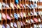 Rows of shelves with colorful ties at shop.