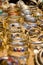 Rows of silver bracelets on gold