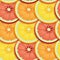 Rows of Sliced critics like orange, lime and grapefruit pattern