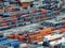 Rows of stacked shipping containers at the cargo port of Barcelona.