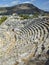 Rows of stone seats of ruins of Theatre in Letoon Ancient City in village Kumluova, Turkey. Sunny day, Greek culture