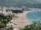 Rows of sun umbrellas and deck chairs on the beaches of new Budva. Montenegro