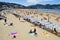 Rows of sunshade on La Concha beach