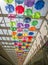 Rows of suspended colored umbrellas