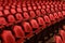 Rows of theater seats in an old vaudeville style theater.