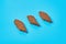 Rows of three brown spicy pieces of rusk bread lies on blue desk in sport bar or pub