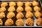 rows of unbaked challah loaves on a baking sheet