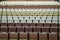 Rows of vacant spectators seats in theater. Abstract background