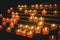 Rows of votive candles in a Catholic church.